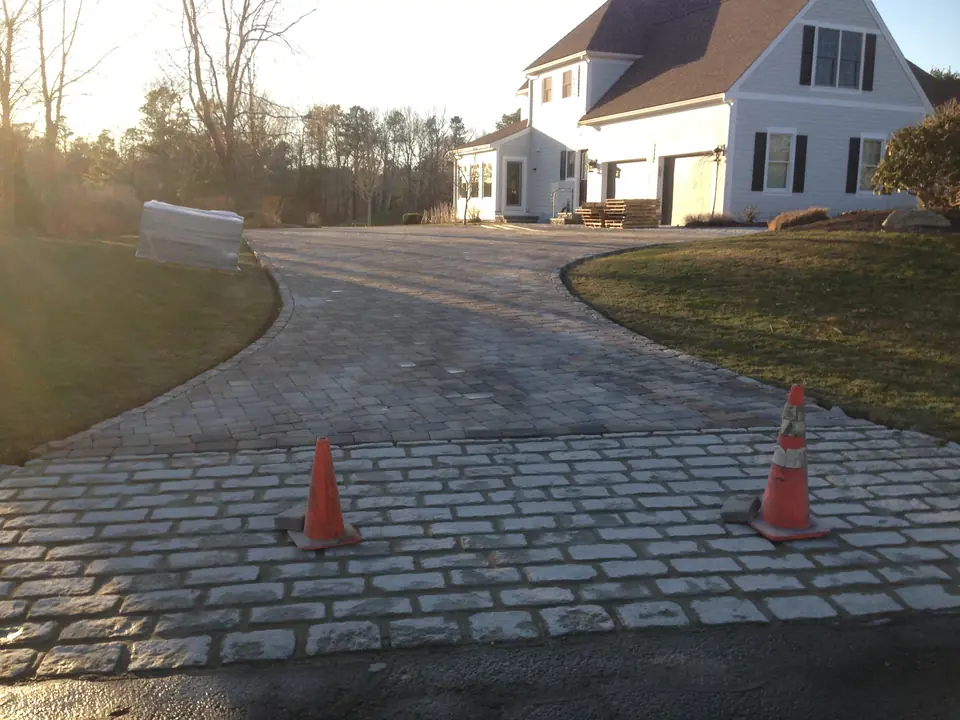 Cobblestone apron at the street end of a driveway