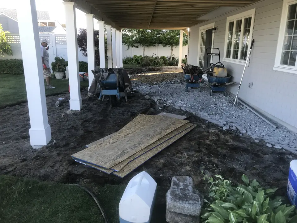 Drainage stone going in along a porch