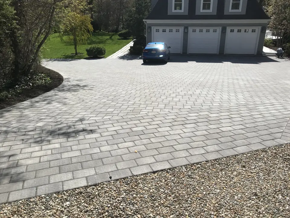 Paver driveway at a three-car garage