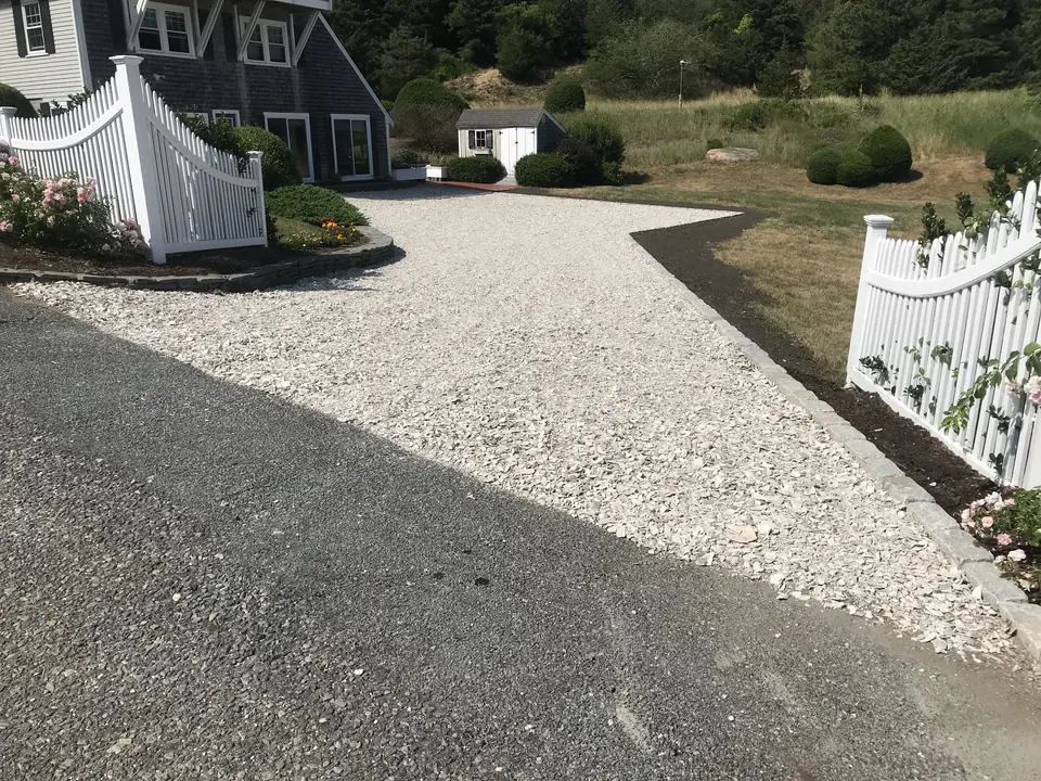 Crushed stone driveway meeting the road
