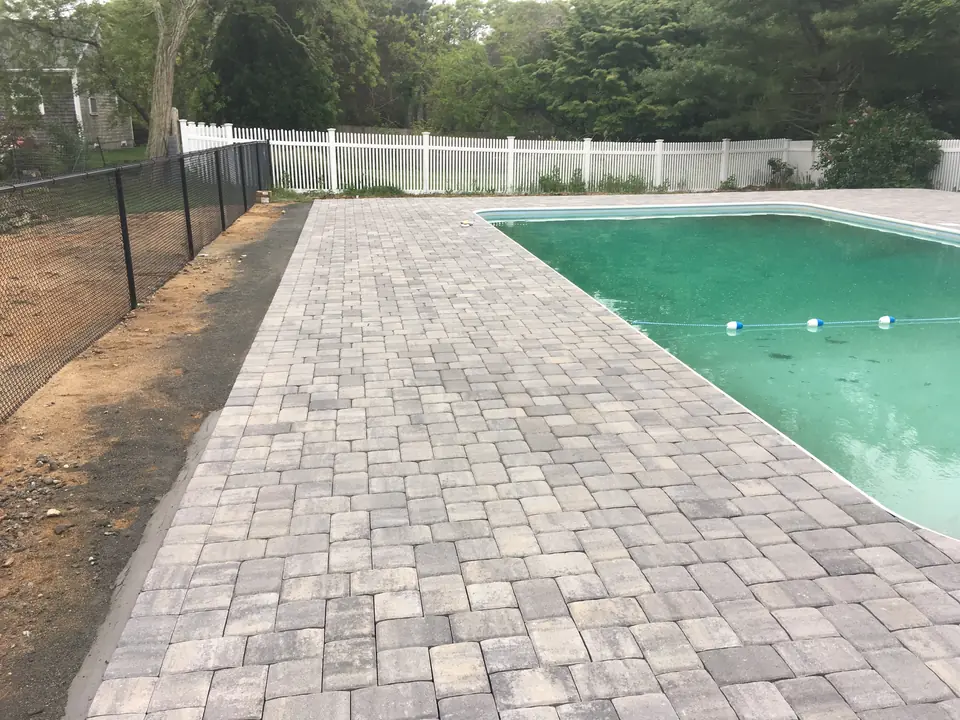 Paver pool deck along the fence