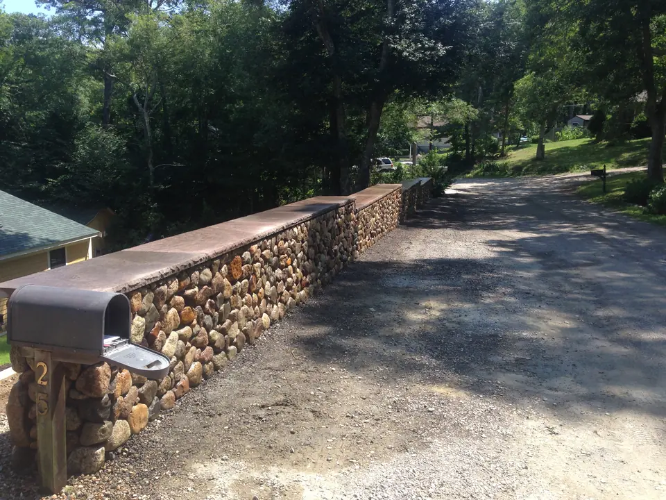 Fieldstone wall along the driveway