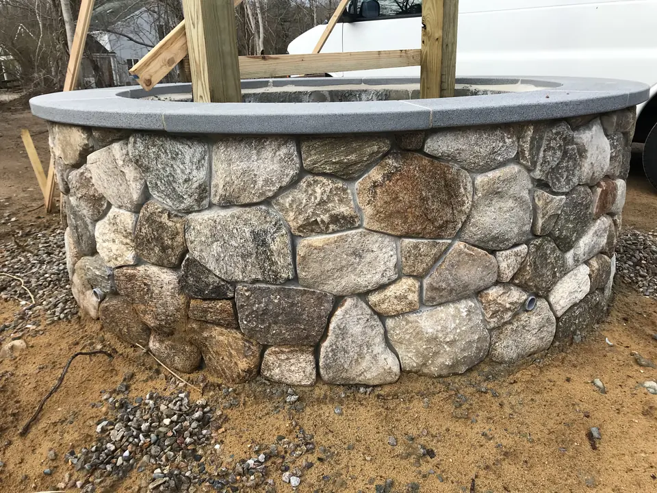 A fieldstone ring with a bluestone cap, going up