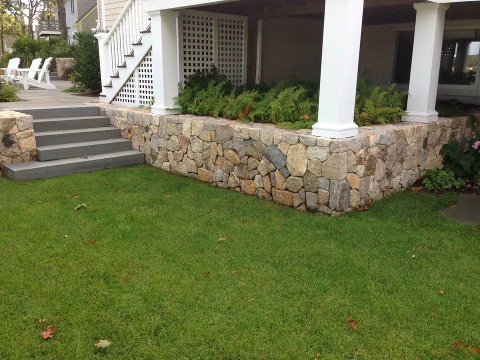 Fieldstone veneer around the base of a porch